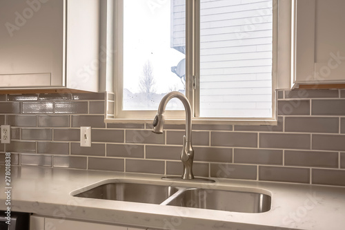 Cuadros en Lienzo Polished kitchen countertop with double basin stainless steel sink and faucet