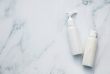 White Cosmetics Bottles On A Marble Background