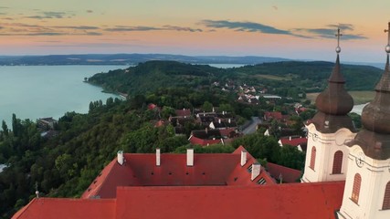 Wall Mural - Tihany, Hungary - Aerial footage of the beautiful Benedictine monastery of Tihany (Tihanyi apatsag) and Lake Balaton at sunrise