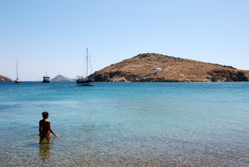 Woman at the beach at Patmos Island in Greece