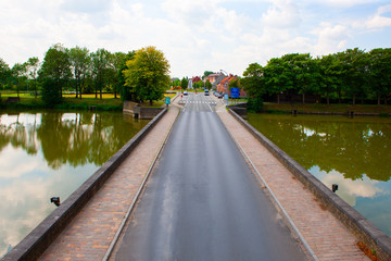 South road to and from town of Ieper, Belgium, beyond Lille Gate over river