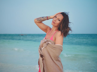 Beautiful woman relaxing near the ocean