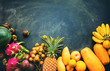 © olga pink - Set fresh organic exotic tropical fruit on dark