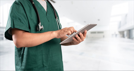 young doctor with hospital background