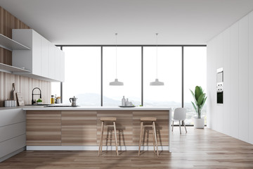 White and wooden kitchen interior with bar