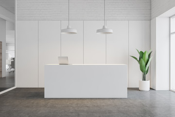 White reception desk in office interior