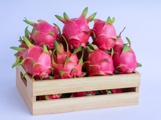 Wall Mural - dragon fruit in basket on white background