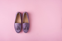 Lilac Suede Moccasins Shoes Over Lilac Pink Background
