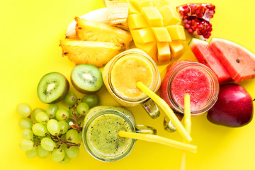 Wall Mural - Juices smoothie red green yellow Tropical fruits