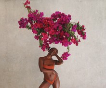 Woman In Bikini Standing Under Bough Of Bougainvillea Flowers