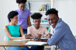 © Daniel Ernst - African american male student learning at desk at school