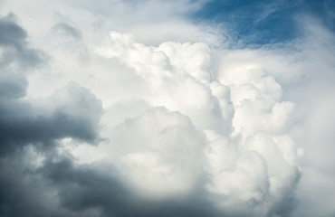 Wall Mural - white curly clouds in a blue sky. sky background