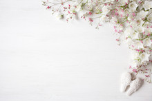 Wooden Background For Congratulations With Flowers Of White Bells And Pink Gypsophila, Angel Wings