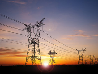 electricity pylons at sunset