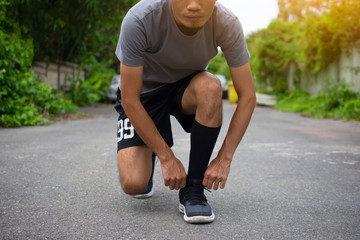 Wall Mural - Runner Man run on the street be running for exercise,Run sports background and closeup at running shoe