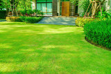 Green grass, Modern house with beautiful landscaped front yard, Lawn and garden blur background., The design concept for background, garden with green lawn and garden