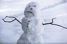 Sad Snowman Frowning In Sierra Winter Snow - California