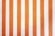 orange vertical strokes at white background. white and orange stripes.