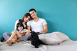 happy family father mother daughter play and enjoy tegether with love and care on white bed home concept