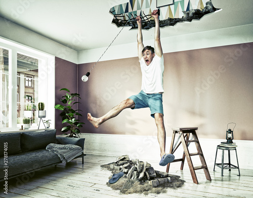 Broken Ceiling And A Man Hanging In The Hole Kaufen Sie