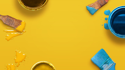 Wall Mural - creative painting composition with color brushes and boxes on yellow surface. top view, flat lay, cl