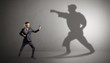 © ra2 studio - Young karate man confronting with his own shadow