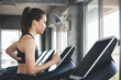 © Peera - Fitness woman running on treadmill in gym