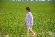 © QKon Studio - Little cute girl running across the soybean field, summer