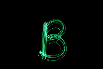 Wall Mural - Long exposure photograph, light painting photography.  Letter b of an alphabet series, single letter, in neon green light, against a black background