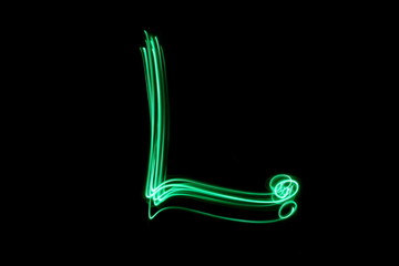 Wall Mural - Long exposure photograph, light painting photography.  Letter l of an alphabet series, single letter, in neon green light, against a black background