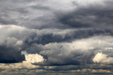 Fototapeta Na sufit - Storm sky covered with dark cumulus clouds before the rain. Dark cloudy sky, overcast day, beautiful dramatic background for stormy weather