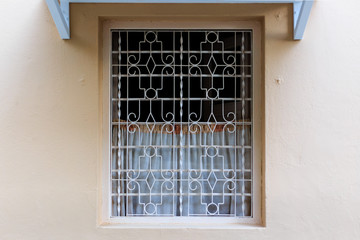 Wall Mural - vintage style window with metal pattern Fence facade