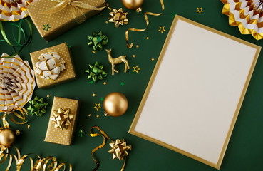 christmas or new year frame decorations in gold colors on dark green background with empty copy spac