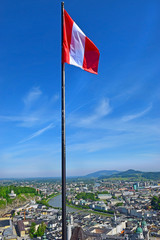 Sticker - austrian national flag on the background of the panoramic view of the magnificent Salzburg, Austria