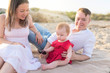 © Konstantin Maslak - Family holiday near the sea. Father, mother and little daughter on beach.