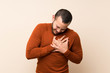 © luismolinero - Colombian man with turtleneck sweater having a pain in the heart