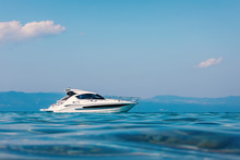 Motor Boat Floating On Clear Turquoise Water