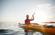 © yossarian6 - Senior man paddling kayak on the sunset sea