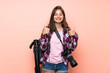 © luismolinero - Young photographer girl over isolated pink background giving a thumbs up gesture