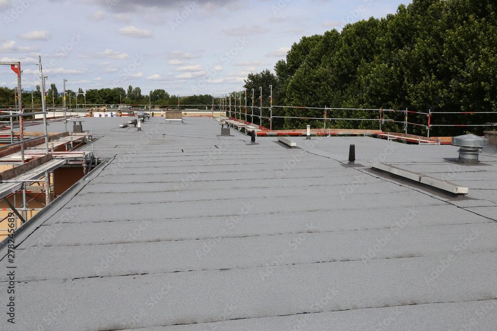 Waterproofing flat roof with bitumen sealing membranes - obrazy, fototapety, plakaty 