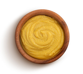 Mustard sauce isolated on white background, top view