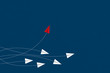 © lukbar - Think differently concept. Red airplane changing direction. New idea, change, trend, courage, creative solution, innovation and unique way concept.