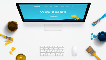 Wall Mural - concept of a modern web design studio with color brushes and color boxes on a clean desk. modern web