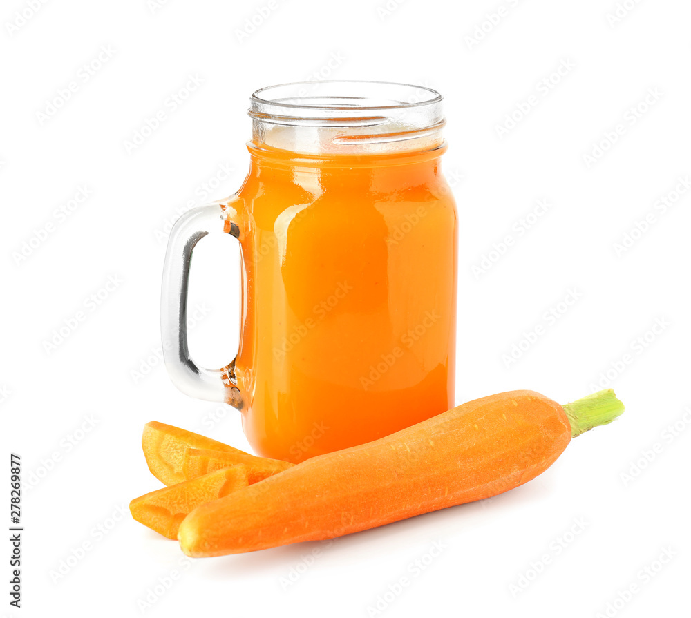 Mason jar of fresh carrot juice on white background