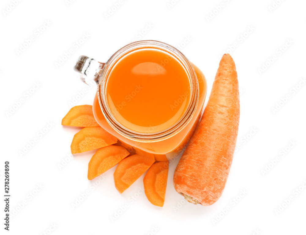 Mason jar of fresh carrot juice on white background