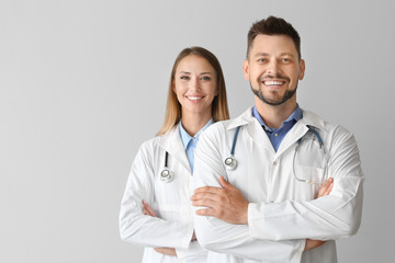 Canvas Print - Portrait of doctors on light background