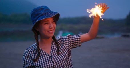 Canvas Print - Woman play with sparklers in the summer time at outdoor