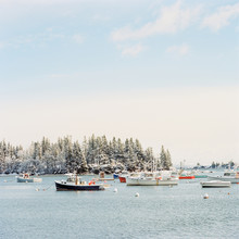Fishing And Lobster Boats Float In The Harbor In Owls Head Maine.