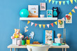 © 365mm/Stocksy - Kid's study with garlands, pictures and toys.