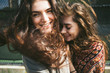 © GIC/Stocksy - Young wild and free female friends outdoors